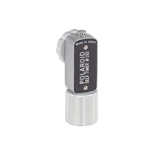 Polaroid self timer (push on). Works with any Polaroid pack film camera.