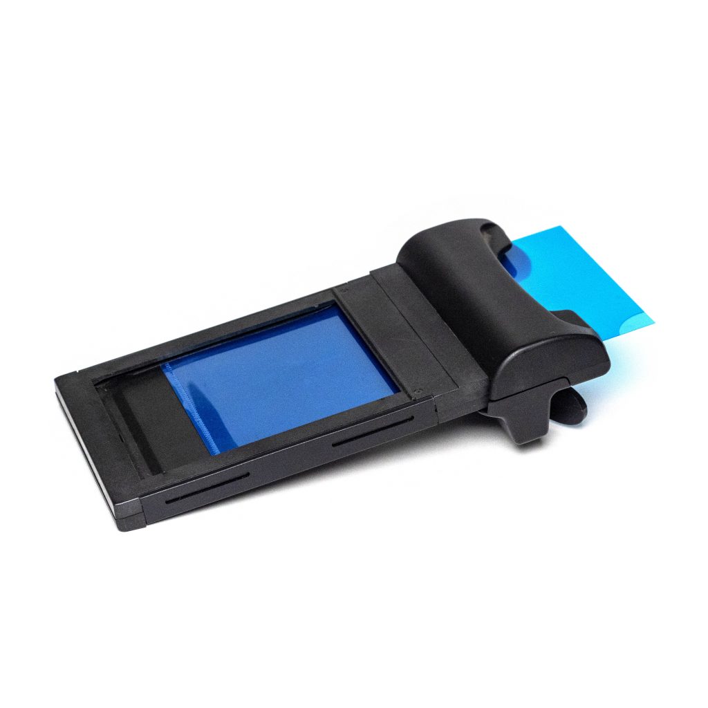 Polaroid 545i film developer with plastic sleeve for Instax Wide developing.