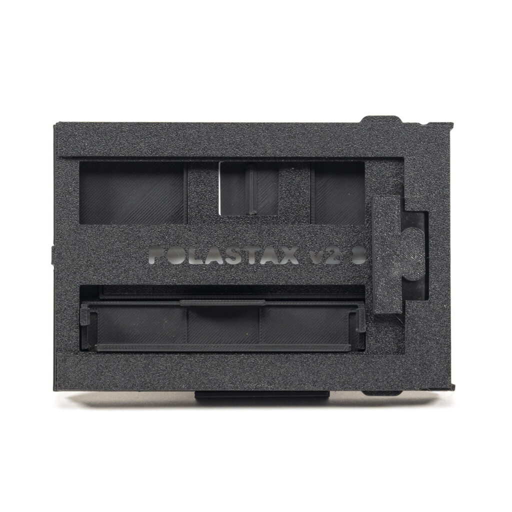 The Polastax Instax Wide Film Holder lets you Use Instax Wide instant film in a Polaroid pack film camera.